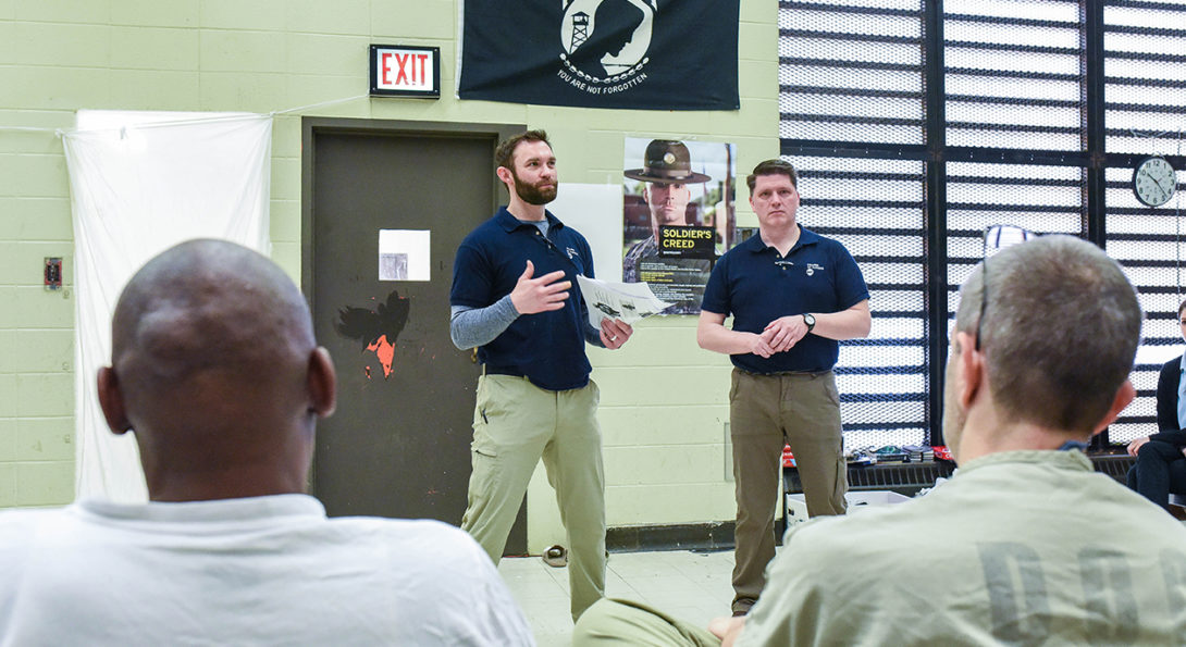Chris O'Brien (left) and Jeremy Baker teaching male detainees
