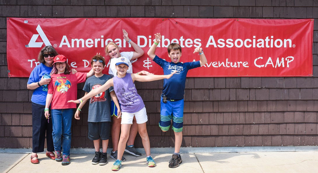 Laurie Quinn with kids at ADA camp