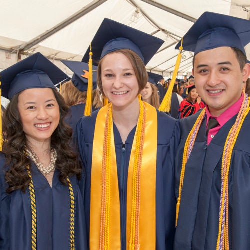 Three students at their graduation