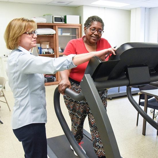 Researcher performing cardiovascular research with subject