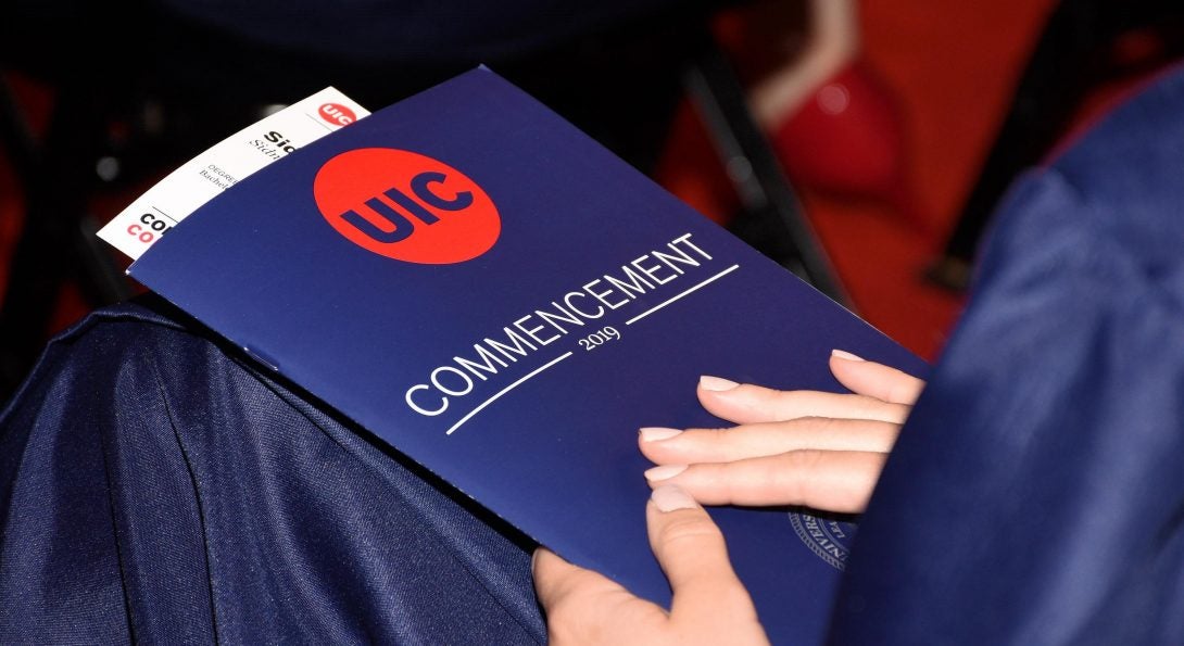 Student sits during past in-person commencement celebration