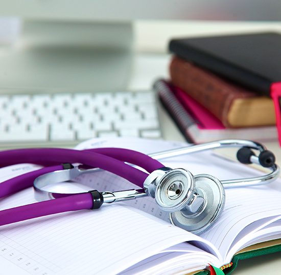 stethoscope with books and computer