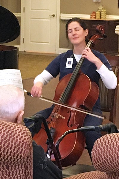 Kirsten Landowne plays cello for patients at the Carriage Crossing Senior Living facility