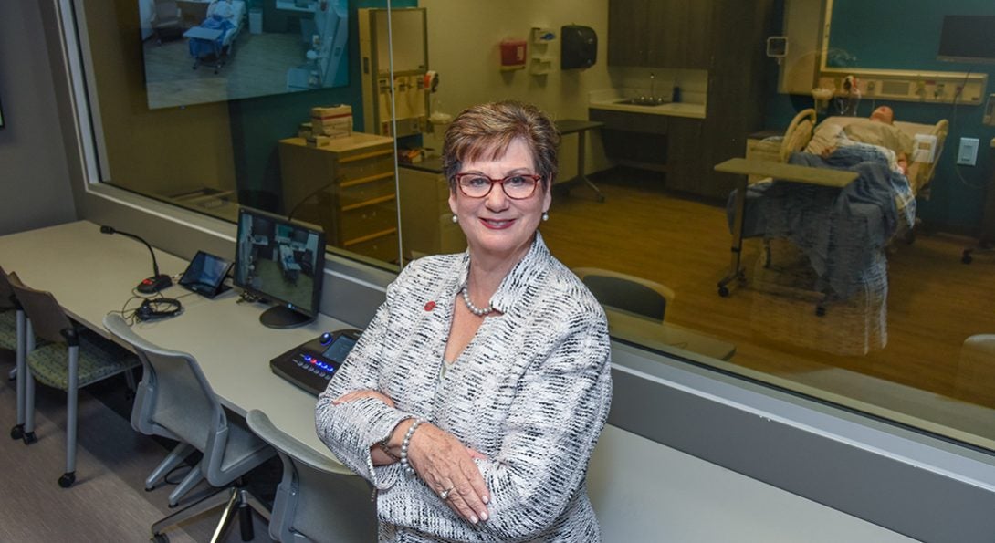 Terri Weaver posting in control room of simulated birthing suite