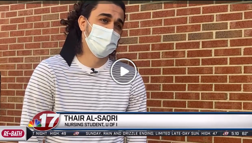 Urbana student Thair Al-Saqri being interviewed by WAND-TV news