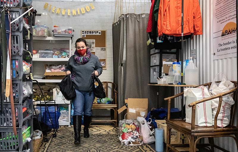 Amanda Treviño organizes supplies to be distributed to immigrants and asylum-seekers arriving at Chicago's South Loop Greyhound bus station.