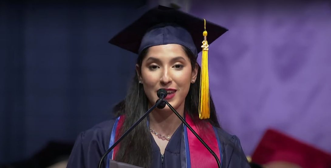 Class of 2022 student speaker Jasmine Medina, BSN '22, at the microphone during commencement the ceremony