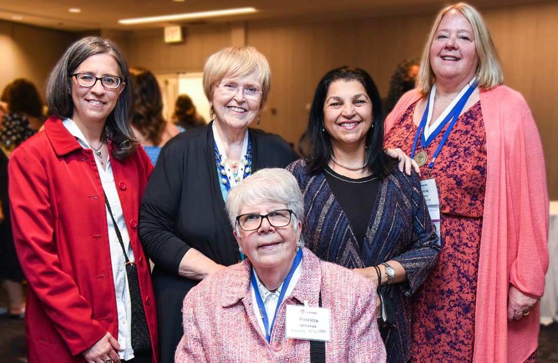 (L-R) Crystal Patil, head of the Department of Human Development Nursing Science; Diane Boyer, MS ’79, BSN ’76; Naeema Al-Gasseer, PhD ’90, MS ’87; Carrie Klima, MS ’86, nurse-midwifery program director; (seated) Patricia Urbanus, one of the first clinical faculty.
