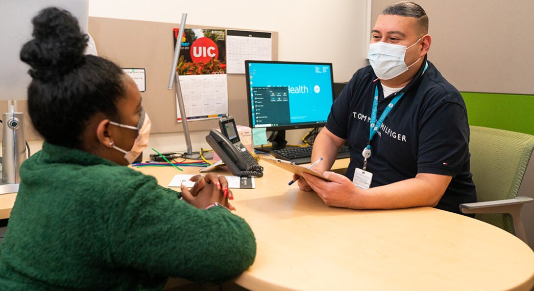 Efren Alonso conducts initial assessment and intake with patient Mickey Garcia