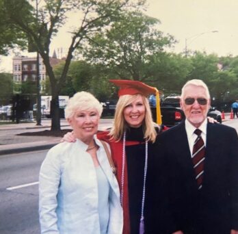 Moriarty on graduation day flanked by her parents 