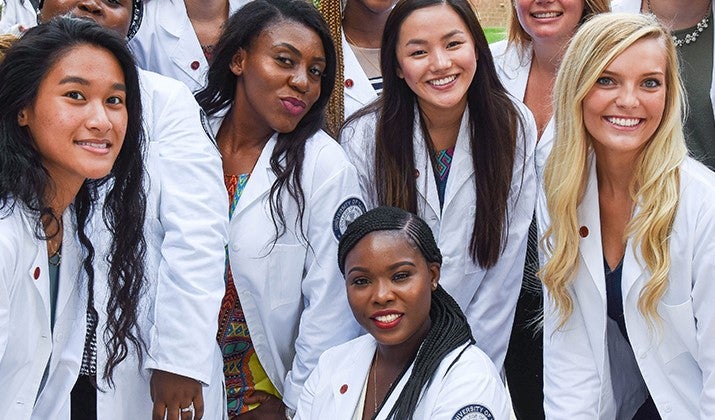 several women smile for a photo