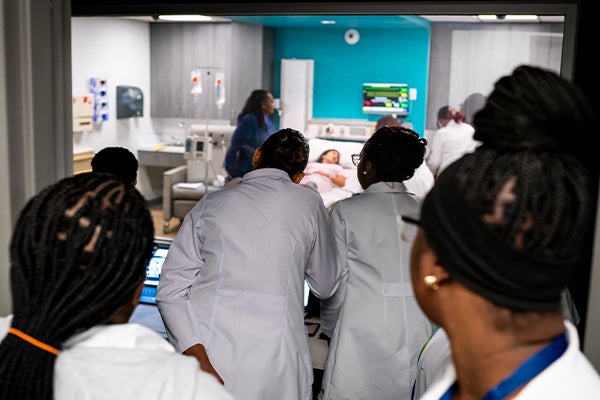 Nurses observe simulation training